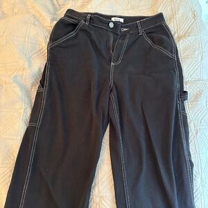 Black Garage Cargo Pants, with white stitching on the side.